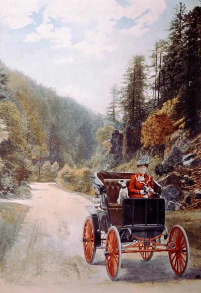 Carte postale représentant une femme souriante assise avec un chien dans une voiture ancienne, vers 1910 - French Photographer